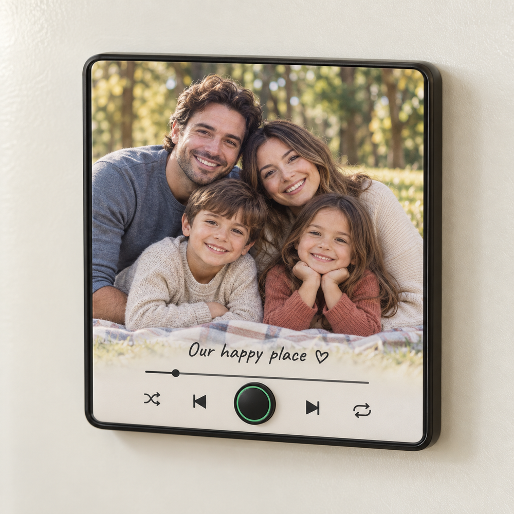 Black music fridge magnet with a family of four smiling in a park and Our happy place caption.