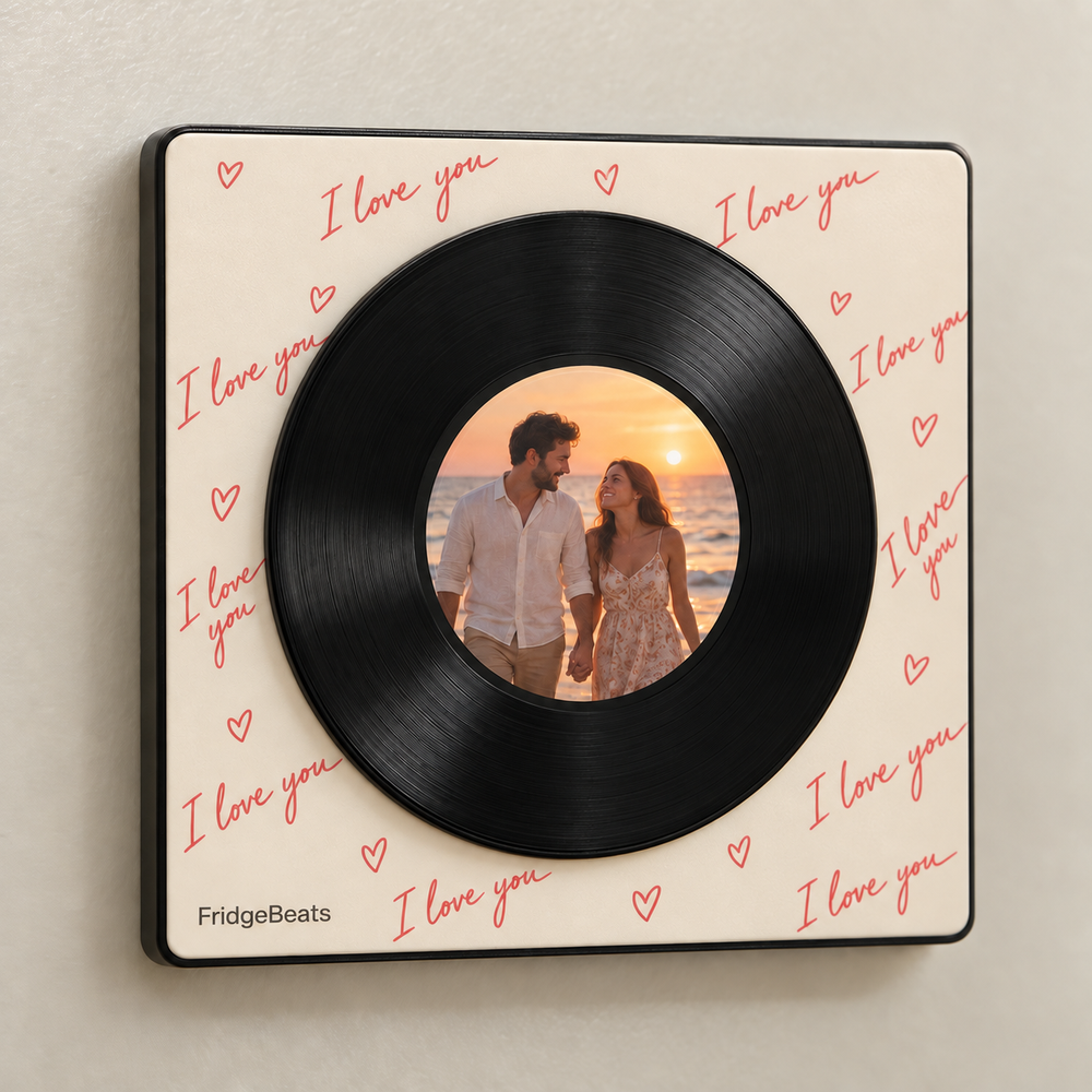Cream vinyl music fridge magnet with coral I love you lettering and a circular sunset couple photo.